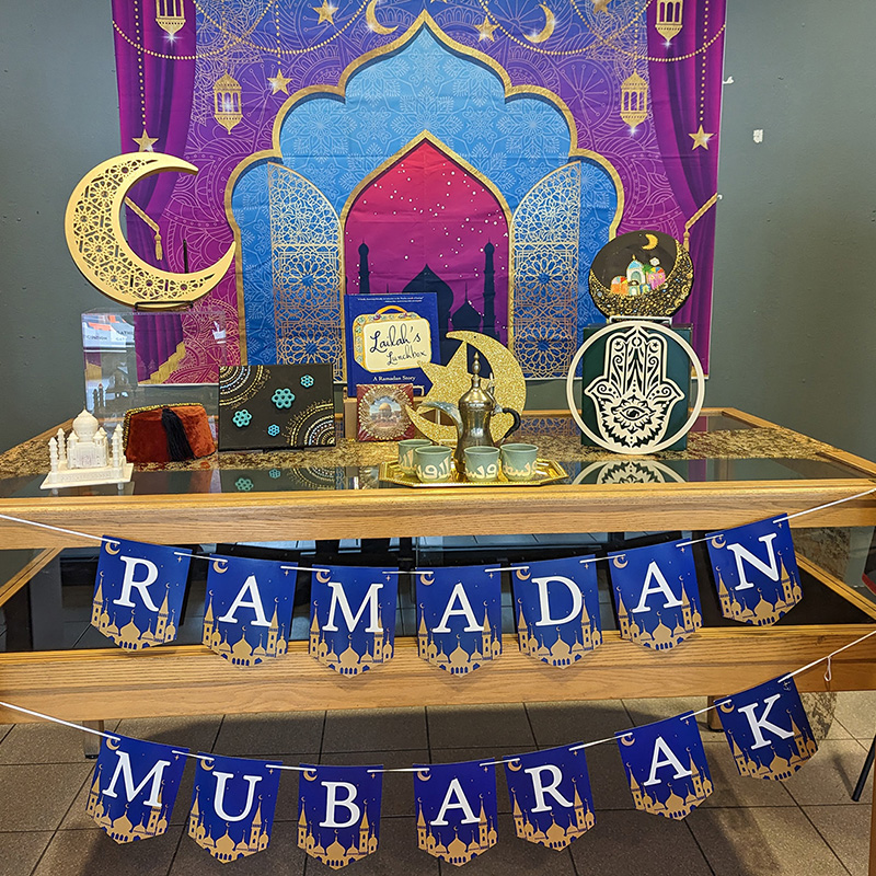Display featuring flags reading "Ramadan Mubarak," crescent moon, mosque