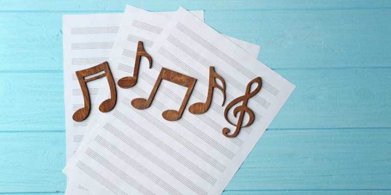 Music notes on sheets of paper