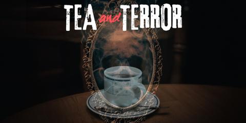 A tea cup sitting on a saucer sitting in front of a mirror with a ghostly skull floating in the center