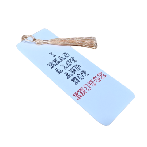 Image of a cardstock bookmark with a beige tassel and the phrase I READ A LOT AND NOT ENOUGH on the bookmark in black and red font.