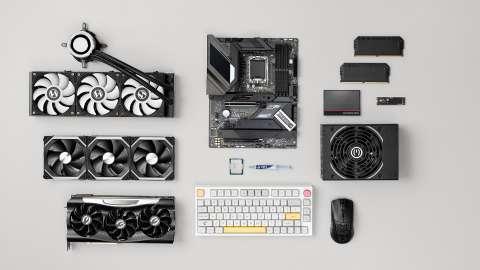 Different computer components spread out on a white countertop
