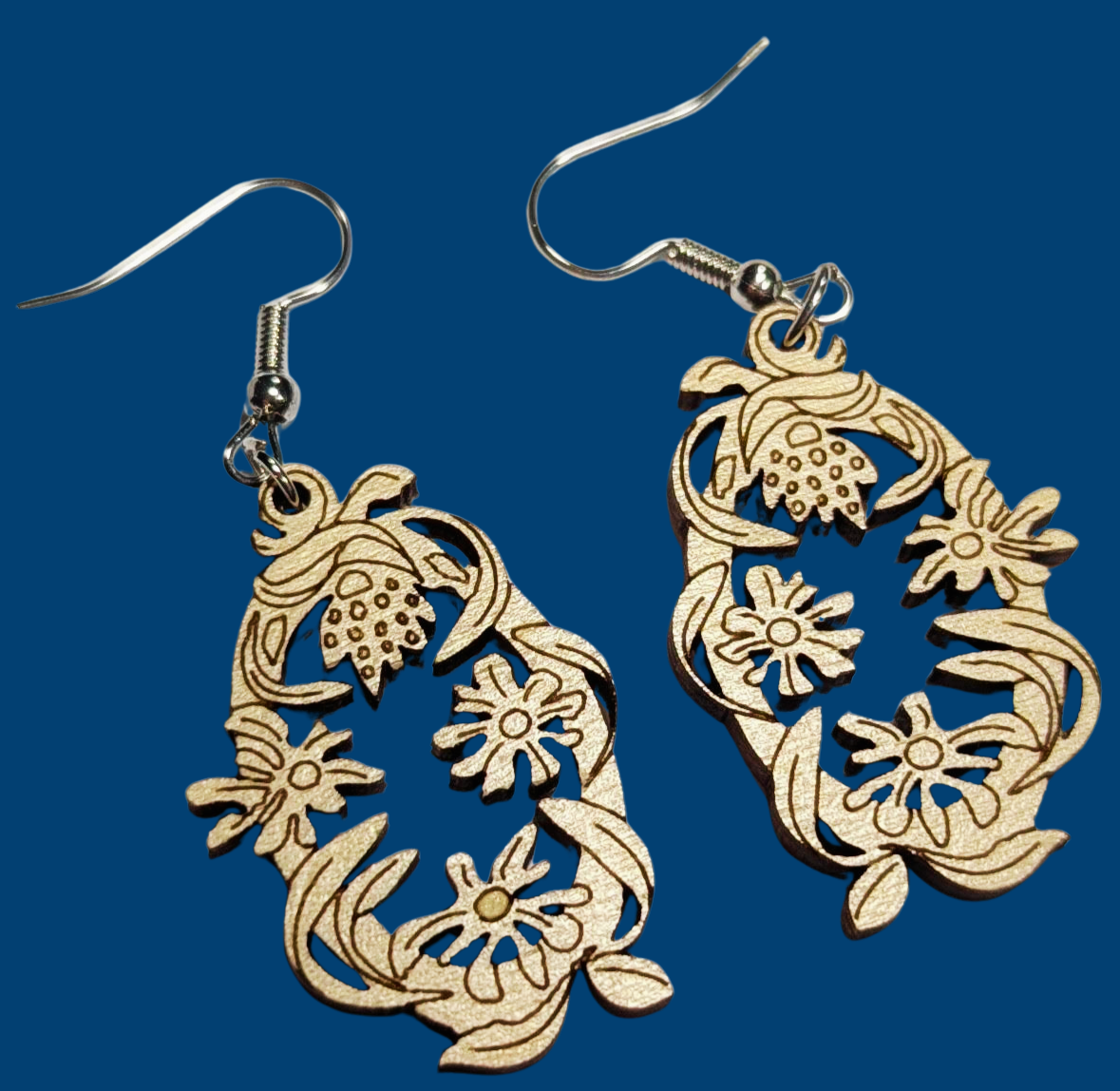 Earrings with a blue background.