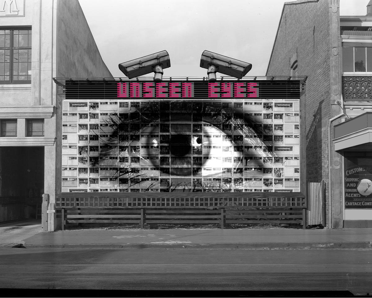 An image of a wall with a gigantic eye with text over it reading Unseen Eyes.